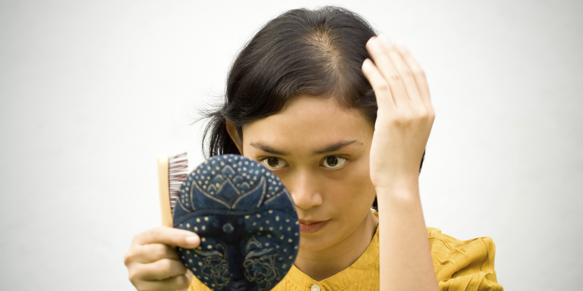 thinning hair concerned woman